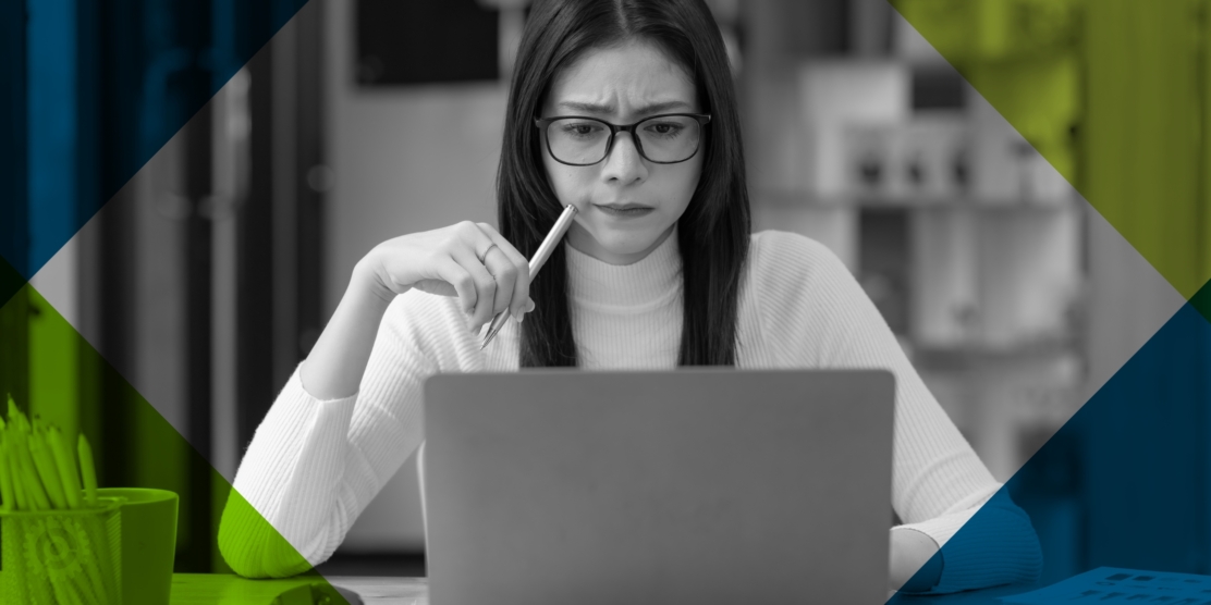 Woman Reviewing On Laptop