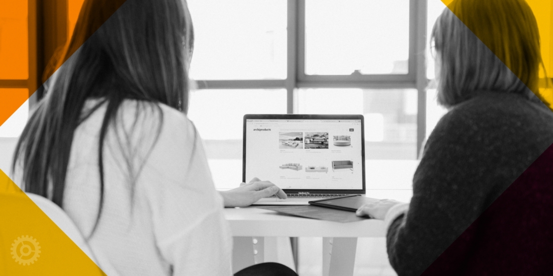 Two women looking at a computer screen